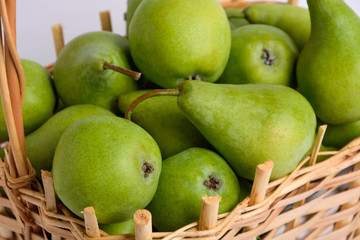 Pears in a basket on a white background
