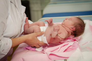 Obraz na płótnie Canvas Cute newborn baby in hospital