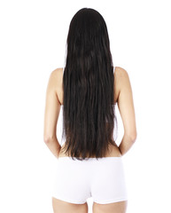 Obraz premium Female Long wavy brunette hair, rear view