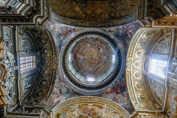 Fototapeta na wymiar Rome, Lazio, Italy. May 22, 2017: Polychrome dome of the Catholic Church called 
