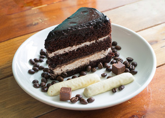 Chocolate soft cake and decoration on wood table