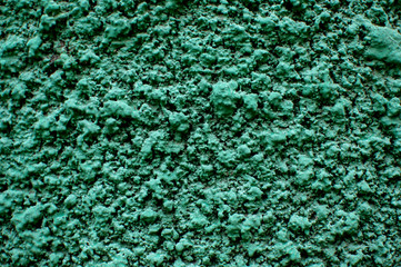 Texture of rough plastered green wall