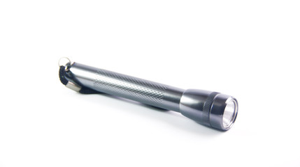Close shot of a led flashlight in a white background