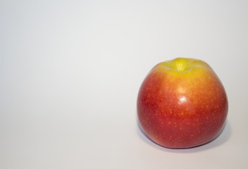 An Apple. Ripe fruit red apple isolated on white background. One apple on a white background.