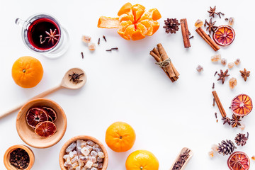 Celebrate new year winter evening with hot drink. Mulled wine or grog ingredients. White background top view.