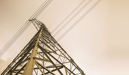 High voltage power line on sunset scene ,distribution electric power for consumer