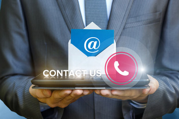 Businessman showing contact us on the tablet.