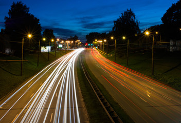 Fototapeta na wymiar Night time traffic light in Riga city, Long Exposure
