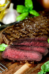 sliced rare steak pepper salt garlic basil