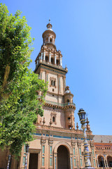 Fototapeta na wymiar North Tower of Plaza de Espana (Spain Square) in Seville. Built for the Expo in 1929 is one of the most famous and beautiful squares in the world. Architecture detail against empty sky background