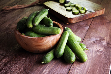 Fresh and sliced cucumbers. Sliced cucumbers on a cutting board. cucumbers for diet and healthy eating.