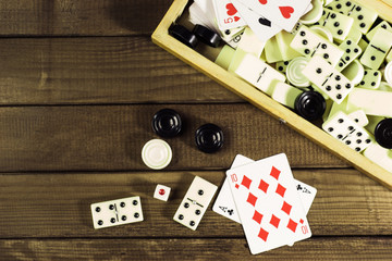 Various board games chess board, playing cards, dominoes. Hobby. Metaphor for games and gambling.