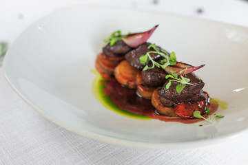 Grilled steak delicious beef meat on a white plate on a light background menu