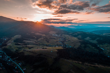 Aerial view of the village in the Carpathian mountains on the Sunset