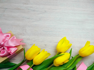 Love, romance, greetings, celebration concept - yellow tulips on white background. delicate petals from a Tulip
