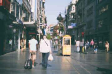     People walking in the street, blurry 