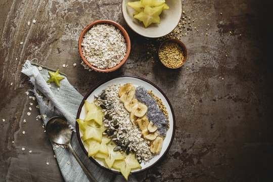 Muesli with carambola, seeds, dried banana and pollen