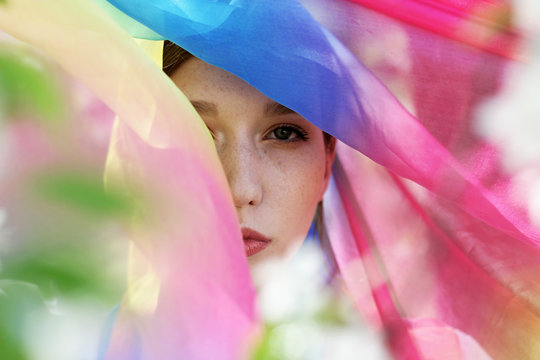 Part of the face covered with colored scarf