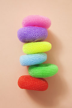 Arrangement of colourful sponges and dish wash clothes