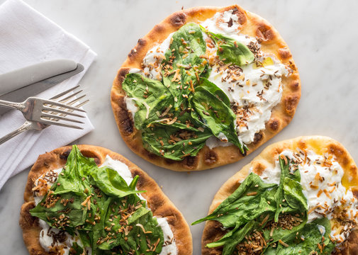 Close-up Of Spinach Yogurt Flatbread Naan Pizza