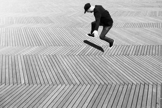 Skater doing a trick on the flat