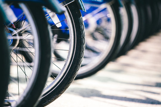 Detail shot of bicycle wheels in row