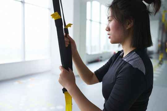 young asian woman in gym