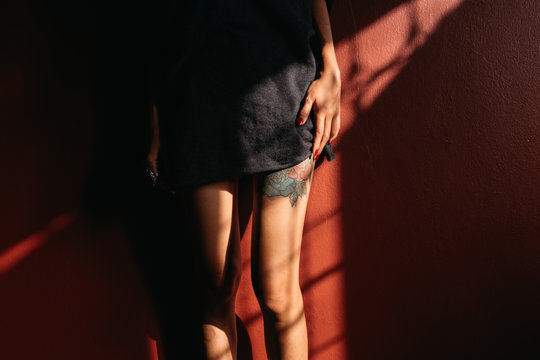 Seductive Thai Woman Slowly Revealing Her Tattooed Thigh