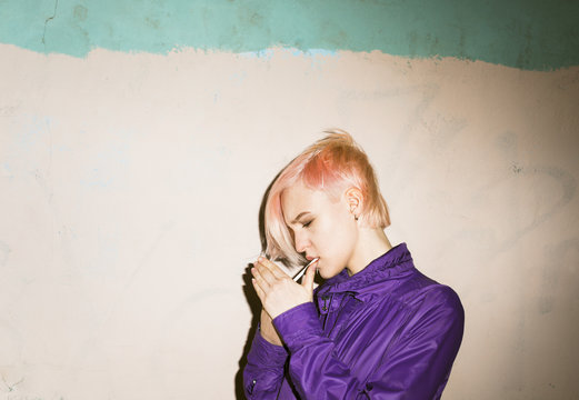 young woman  lighting cigarette