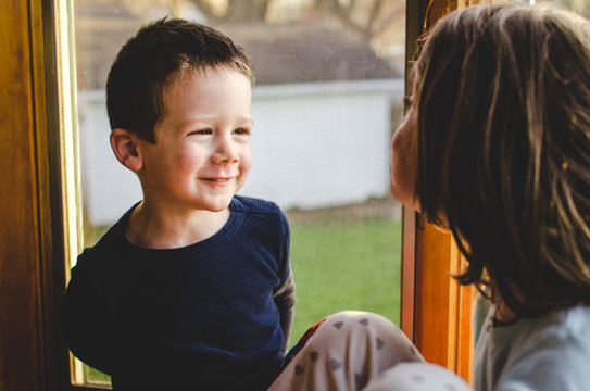 Two Children Talking To Each Other