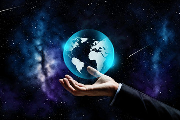 close up of businessman hand with earth projection