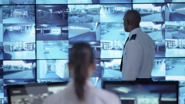  Surveillance team watching CCTV screens & reacting to suspicious activity