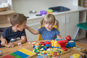 Fototapeta premium Montessori education, kids are playing and learning