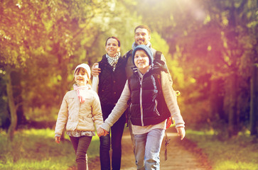 Fototapeta premium happy family with backpacks hiking