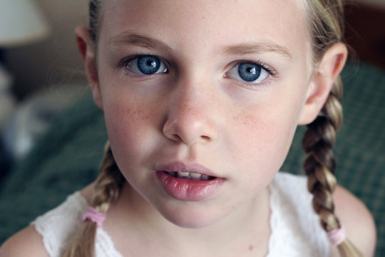 Fair Skinned, Freckled Face Blonde in Braids