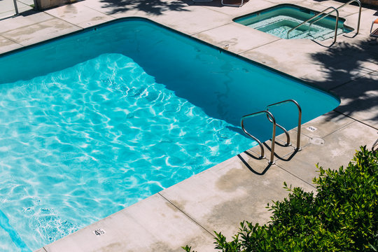 Step Ladder Leading Into Bright Blue Swimming Pooll