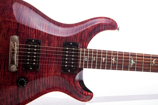 Luxury electric guitar. Expensive flame top wood grain electric guitar in close up