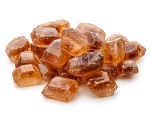 Brown caramelized lump cane sugar cube isolated on white background cutout