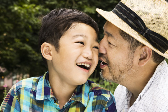 Happy Asian father and son