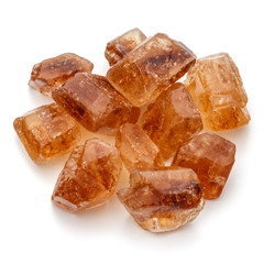 Brown caramelized lump cane sugar cube isolated on white background cutout