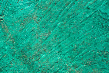Old surface covered with green paint - vintage background, texture