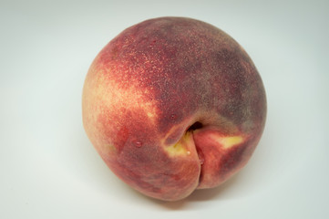 Fresh peach isolated on white background .