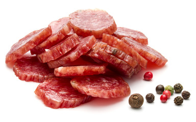 Salami smoked sausage slices and peppercorns isolated on white background cutout