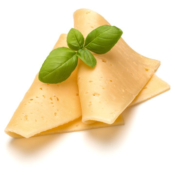 cheese slices and basil herb leaves isolated on white background cutout