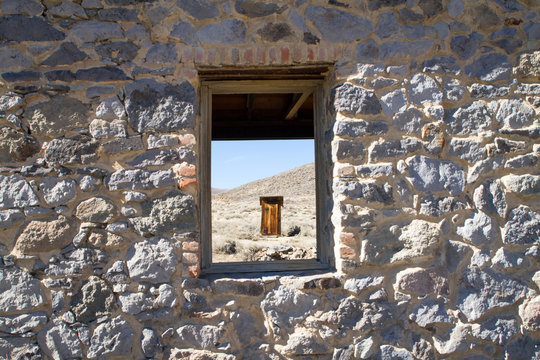 Peering Through Stone Window Frame of Ghost Town Building