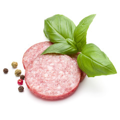 Salami smoked sausage three slices, basil leaves and peppercorns isolated on white background cutout