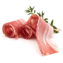 Italian prosciutto crudo or jamon. Raw ham. Isolated on white background