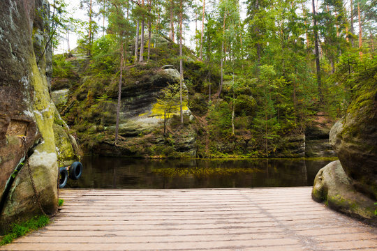 View from pier on small lake in the rock mountain Adrspasske skaly, Czech republic