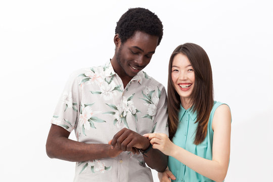 Mixed Couple Checking The Hand Watch