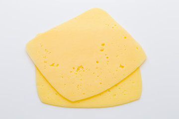 Cheese slices on the white background.